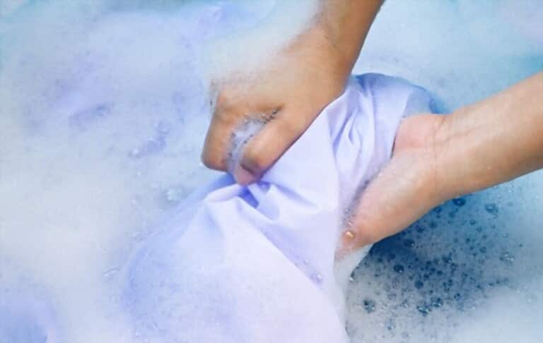 symbolic image of washing clothes by hand