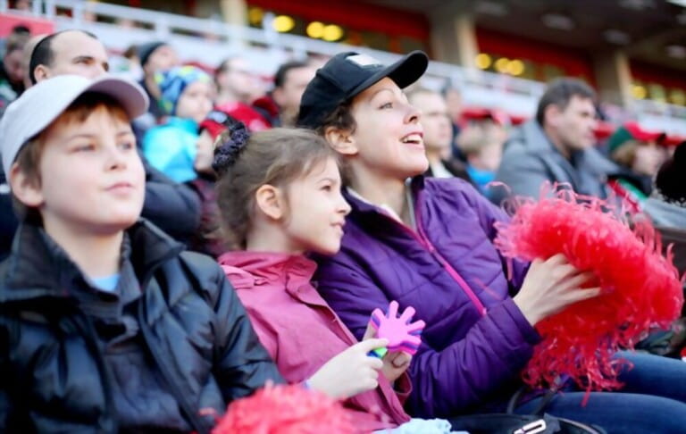 mother daughter son among fans stadium with chilly baseball outfit and hats mother daughter son among fans stadium with chilly baseball outfit and hats