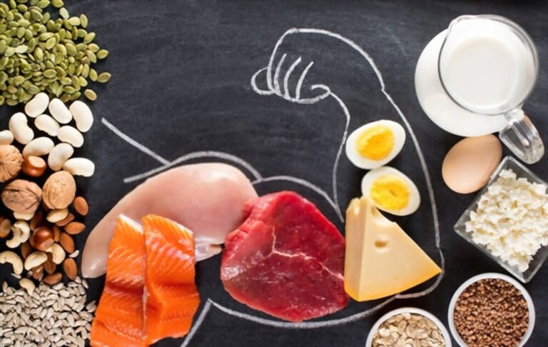 Protein rich foods for body builders like meat, fish, milk, eggs, buckwheat, oatmeal, nuts, beans, pumpkin seeds and sunflower seeds. View from above. Protein rich foods for body builders like meat, fish, milk, eggs, buckwheat, oatmeal, nuts, beans, pumpkin seeds and sunflower seeds. View from above.