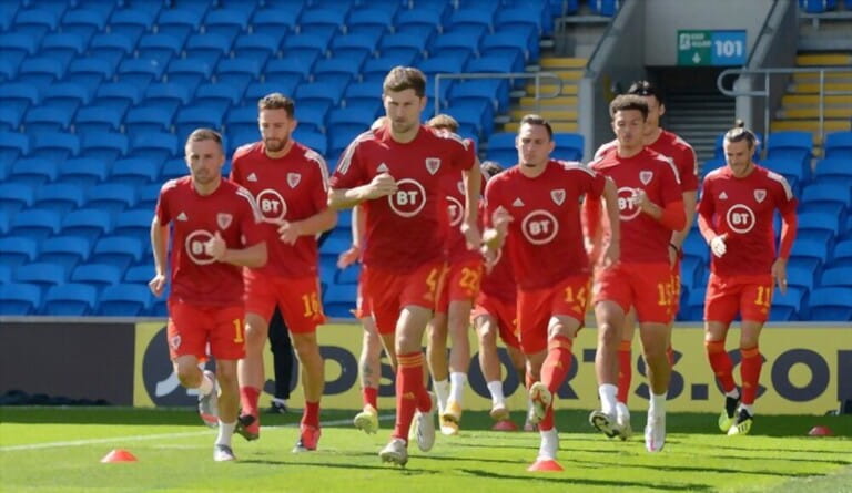 CARDIFF, WALES, - 06 SEPTEMBER, 2020: The Wales team warm up ahead of their match v Bulgaria Wales v Bulgaria, Nations League Fixture, Cardiff City Stadium, Cardiff, Wales CARDIFF, WALES, - 06 SEPTEMBER, 2020: The Wales team warm up ahead of their match v Bulgaria Wales v Bulgaria, Nations League Fixture, Cardiff City Stadium, Cardiff, Wales