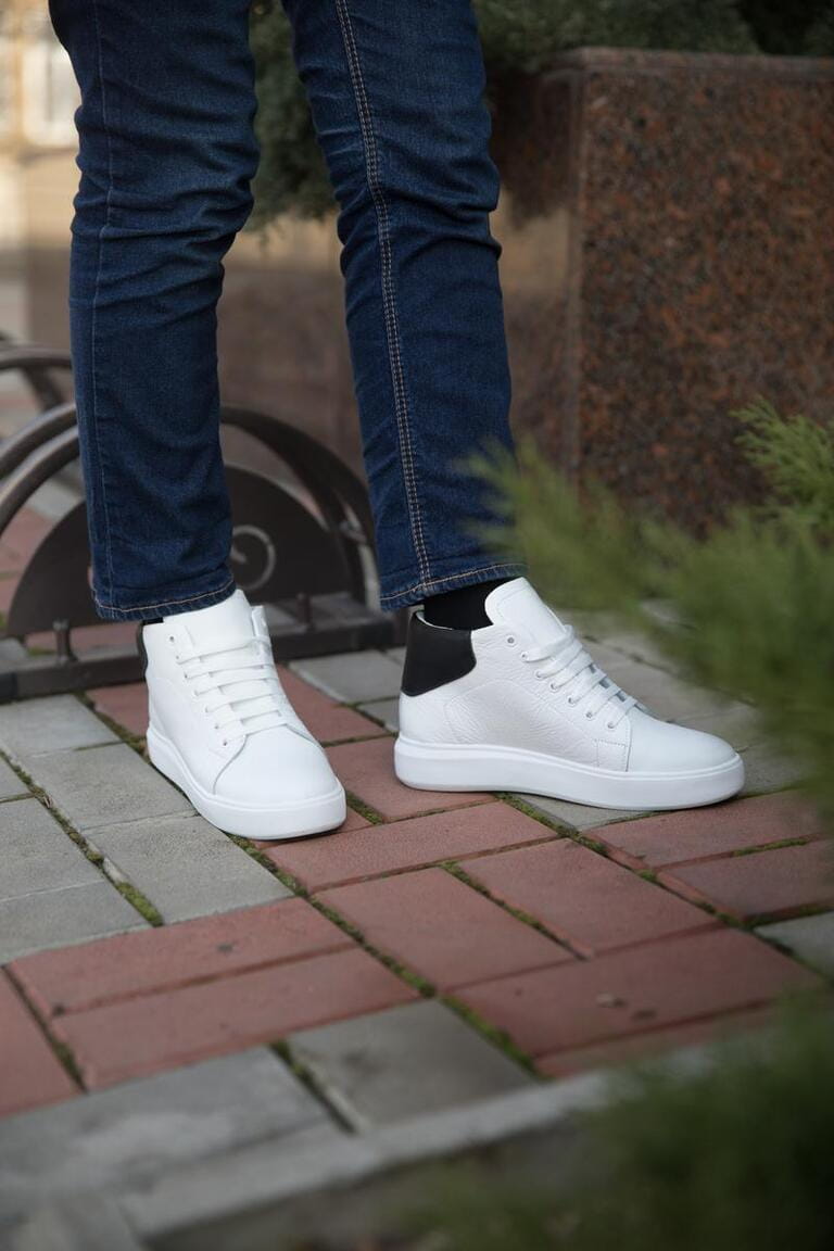 Close up of model in white sneakers