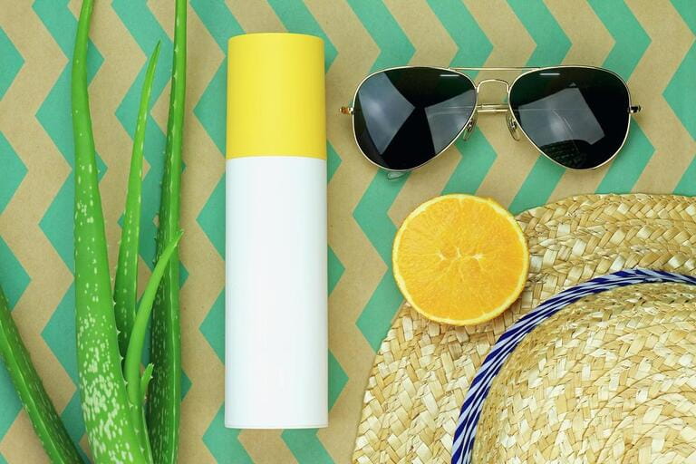 Summer refreshment, Natural and chemical sunscreen protection, Sunglasses, Aloe vera, Fresh fruit, Straw hat, Suncreen lotion. 