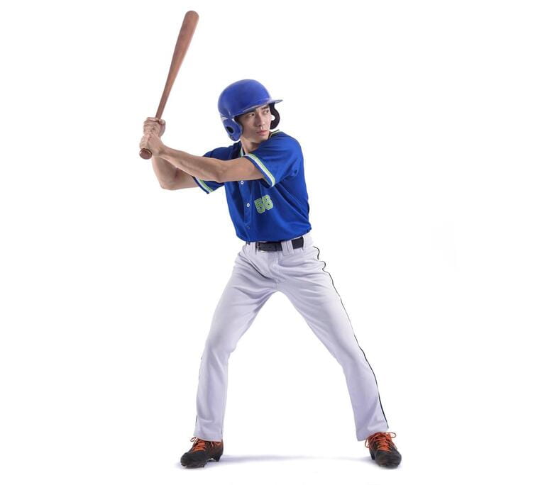Baseball player in action and isolated on white Baseball player in action and isolated on white