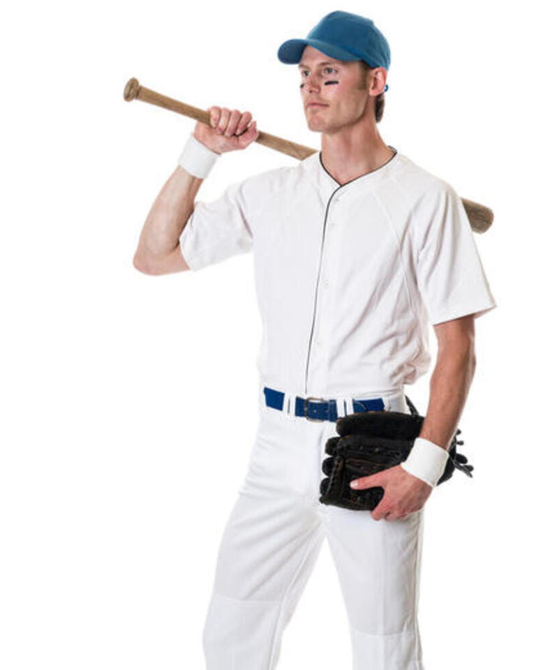 Young adult baseball player. Studio shot over white.