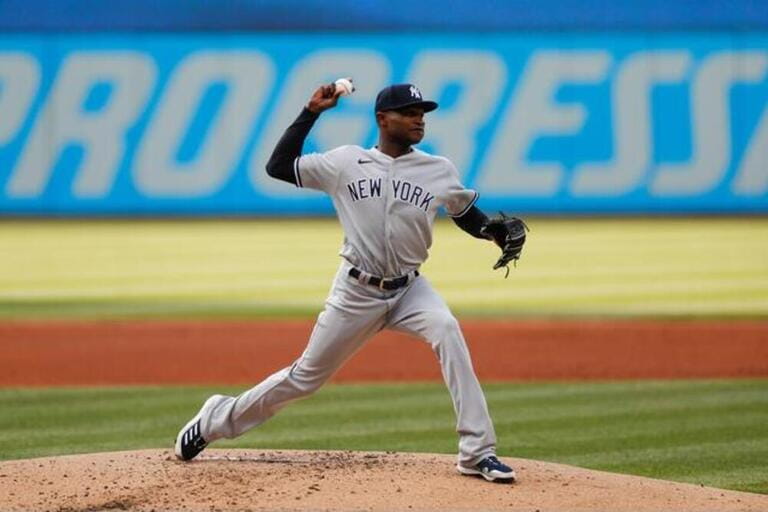 New York Yankees pitcher Domingo Germán (55) throws the ball to first base during an MLB regular season game New York Yankees pitcher Domingo Germán (55) throws the ball to first base during an MLB regular season game