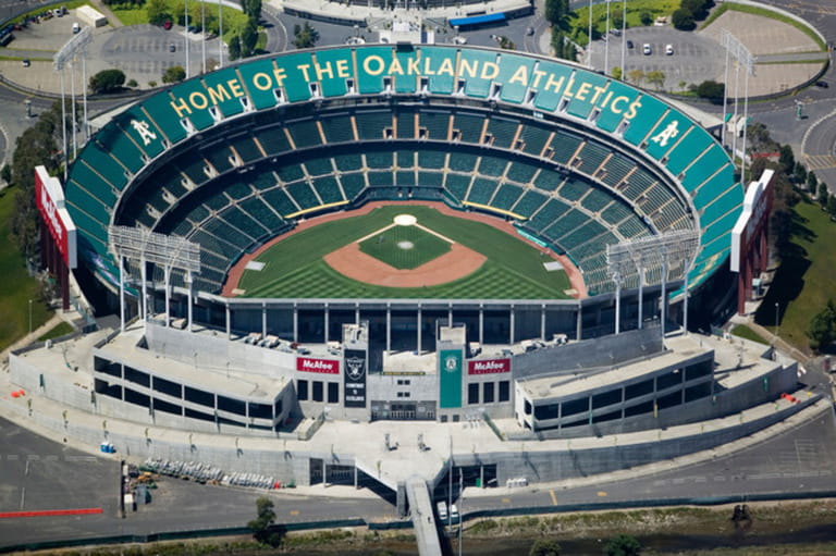 A few members of the Oakland Athletics baseball team train in a virtually empty McAfee Oakland Coliseum A few members of the Oakland Athletics baseball team train in a virtually empty McAfee Oakland Coliseum