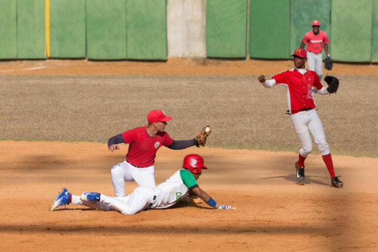 The Academia Provincial de Beisbol stadium featuring youth baseball in Cienfuegos, Cuba. The Academia Provincial de Beisbol stadium featuring youth baseball in Cienfuegos, Cuba.