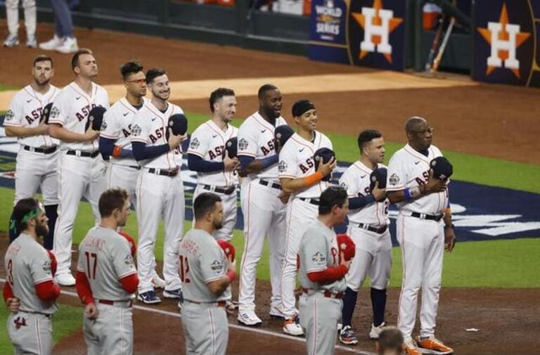 Houston, USA. 28th Oct, 2022. The Houston Astros and Philadelphia Phillies listen to the national anthem before the start of game one of the 2022 World Series at Minute Maid Park in Houston Houston, USA. 28th Oct, 2022. The Houston Astros and Philadelphia Phillies listen to the national anthem before the start of game one of the 2022 World Series at Minute Maid Park in Houston