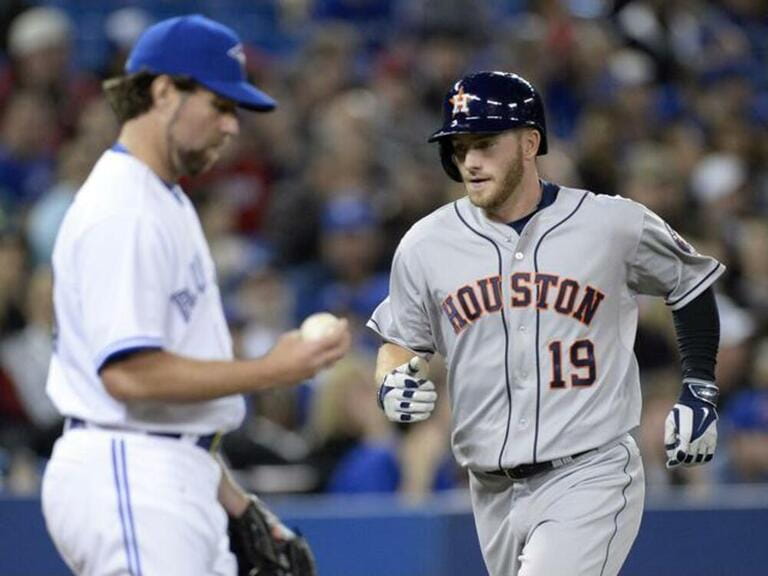 Houston Astros' Robbie Grossman rounds the bases after his two run homer as Toronto Blue Jays pitcher R.A. Dickey makes his way back to the mound during fifth inning AL baseball action in Toronto Houston Astros' Robbie Grossman rounds the bases after his two run homer as Toronto Blue Jays pitcher R.A. Dickey makes his way back to the mound during fifth inning AL baseball action in Toronto