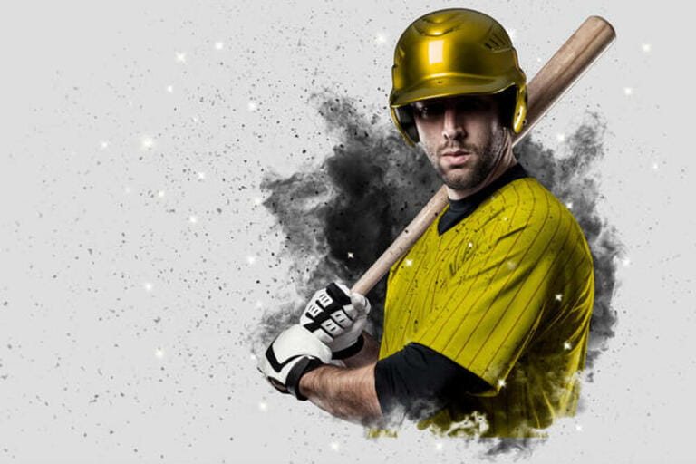 Baseball Player with a yellow uniform coming out of a blast of smoke .