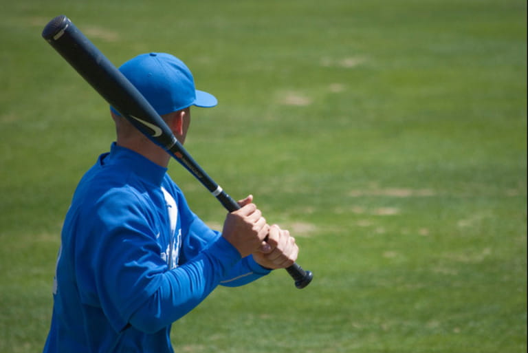 A player for the Blue Devils of Duke University warming up before a College Baseball game A player for the Blue Devils of Duke University warming up before a College Baseball game