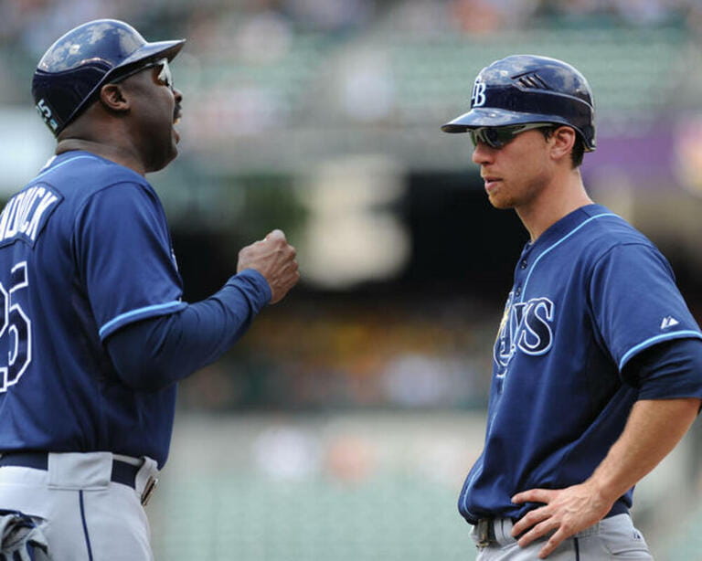  Tampa Bay Rays right fielder Ben Zobrist (18) talks to Tampa Bay Rays first base coach George Hendrick (25) during the sixth inning of Wednesday afternoon's 5-4 win over the Baltimore Orioles at Camden Yards in Baltimore, MD...Mandatory Credit: Russell Tracy / Southcreek Global
