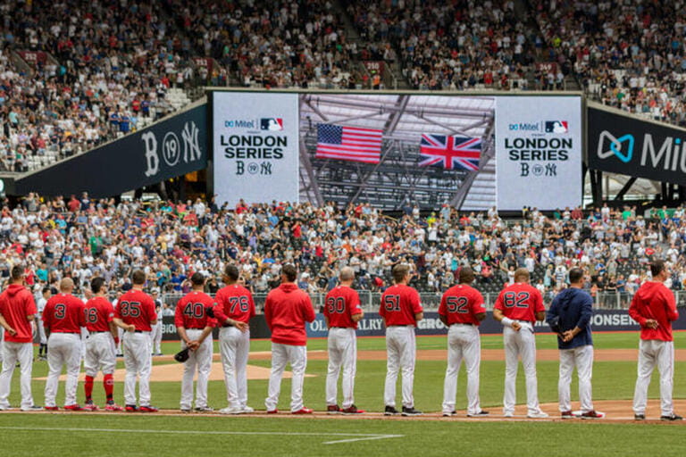 London Stadium, London, UK. 30th June, 2019. Mitel & MLB Present London Series Baseball, Boston Red Sox versus New York Yankees; The Boston Red Sox players listening to the national anthems before the game with the two nations flags displayed on the large display in the stands Credit: Action Plus Sports/Alamy Live News London Stadium, London, UK. 30th June, 2019. Mitel & MLB Present London Series Baseball, Boston Red Sox versus New York Yankees; The Boston Red Sox players listening to the national anthems before the game with the two nations flags displayed on the large display in the stands Credit: Action Plus Sports/Alamy Live News